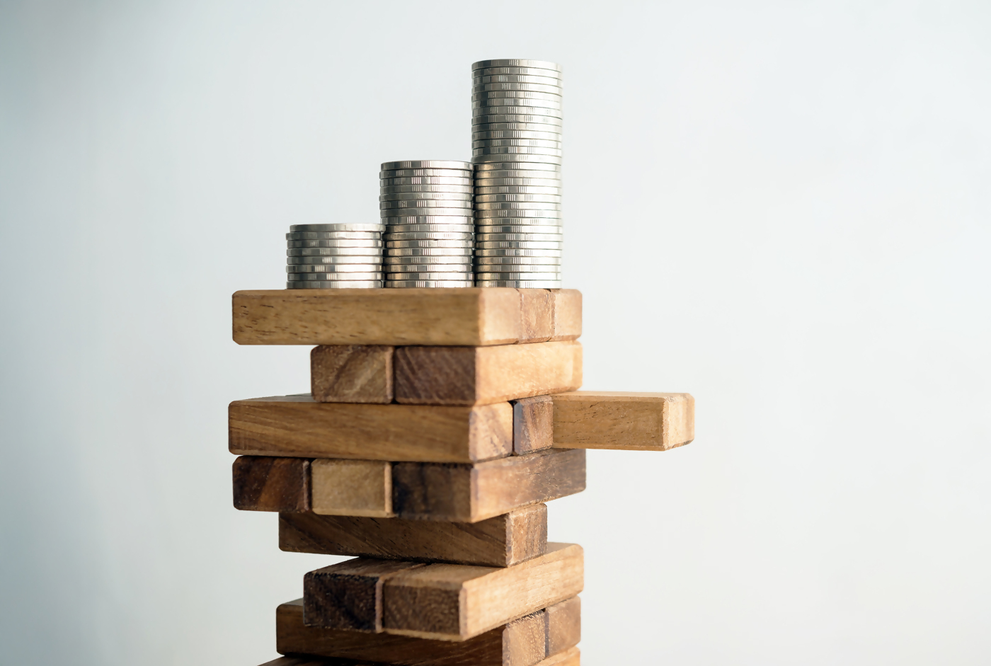 stack of money on wooden blocks